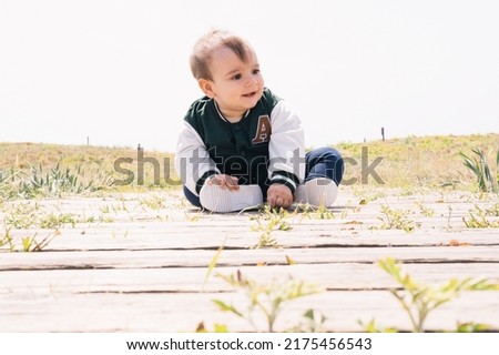 Boy playing on the beach.