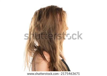 Profile of a young woman with messy long hair on a white background. Royalty-Free Stock Photo #2175463671