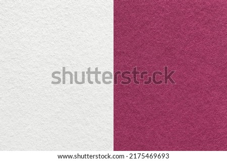Texture of craft white and dark wine paper background, half two colors, macro. Structure of vintage dense purple cardboard. Felt backdrop closeup. Royalty-Free Stock Photo #2175469693