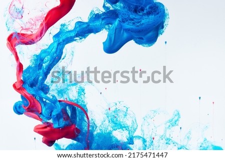 Mixed ink dynamic abstract background with splash of acrylic paint in water