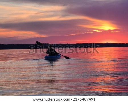 Kayaking the sunset Torch Lake MI Royalty-Free Stock Photo #2175489491