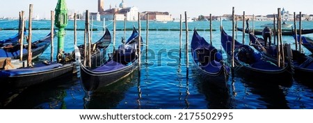 view of San Giorgio island with row of Gondolas, Venice Italy, web banner