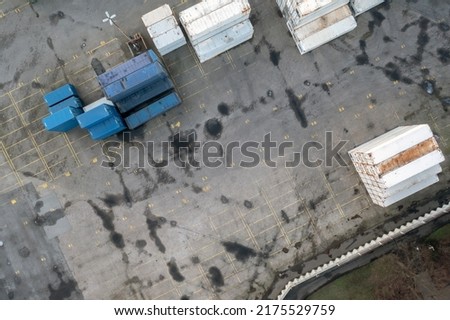 Top view of pretty empty container yard in port Royalty-Free Stock Photo #2175529759