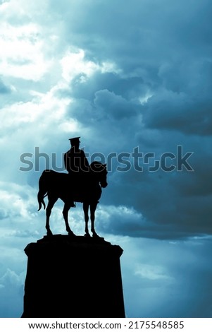 Silhouette of Statue of Mustafa Kemal Ataturk in Ulus Ankara with cloudy sky. 19th may or 19 mayis or 30th august or 30 agustos or 29th october or 29 ekim public holidays background photo. Royalty-Free Stock Photo #2175548585
