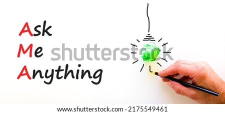 AMA ask me anything symbol. Concept words AMA ask me anything on white paper on a beautiful white background. Businessman hand. Business and AMA ask me anything concept. Copy space.