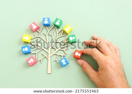 Business image of wooden tree with people icons over green background, human resources and management concept Royalty-Free Stock Photo #2175551463