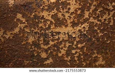 Photo of the texture of a rusty sheet of metal. Corrosion of metal on the armor from the tank. Rusty background for text. Royalty-Free Stock Photo #2175553873