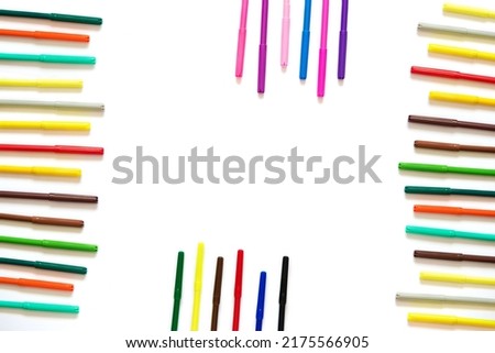 Multicolored felt-tip pens on an isolated white background. Back to school. Royalty-Free Stock Photo #2175566905