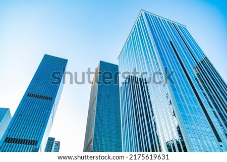 Urban skyscrapers under blue skies