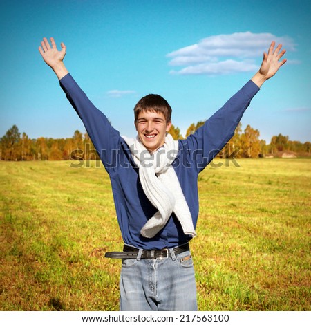 Toned photo of Happy Teenager outdoor rising up the Hands