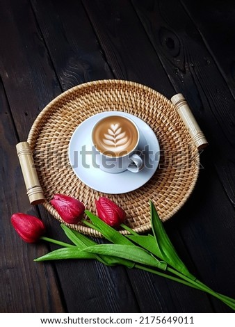  A cup of cappuccino, flatlay composition with flowers. still life photography, 
