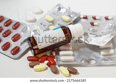 expired drugs with small bottle in the foreground Royalty-Free Stock Photo #2175666185