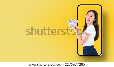 happy asian woman excited holding money US dollars banknotes and wallet comes out from the phone screen, person finance and employment, cash withdrawal smart phone mobile online application.
