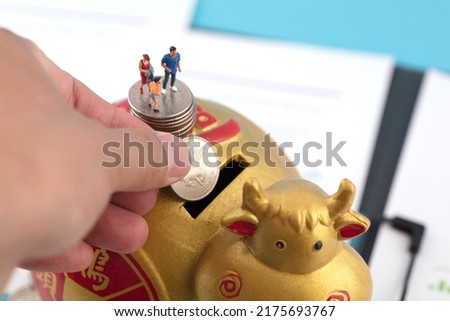 Miniaturized world household savings and living security.The Chinese characters in the picture mean "good luck comes first"
