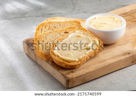 Healthy wholemeal toast with butter. Royalty-Free Stock Photo #2175740599