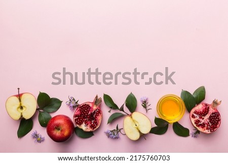 Flat lay composition with symbols jewish Rosh Hashanah holiday attributes on colored background, Rosh hashanah concept. New Year holiday Traditional. Top view with copy space. Royalty-Free Stock Photo #2175760703