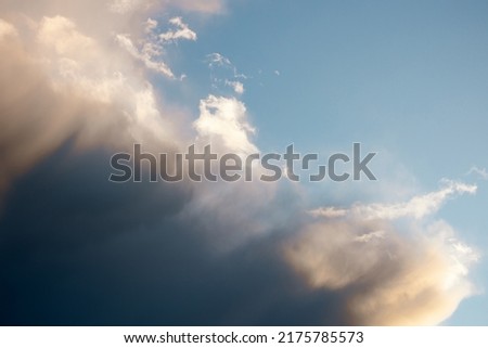 Partly cloudy evening sky in pastel colors