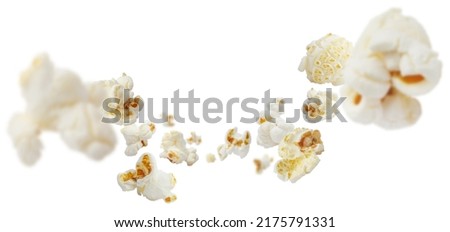 Flying popcorn, isolated on white background Royalty-Free Stock Photo #2175791331