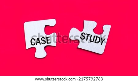 On a bright red background, two white puzzles with the text CASE STUDY. View from above.