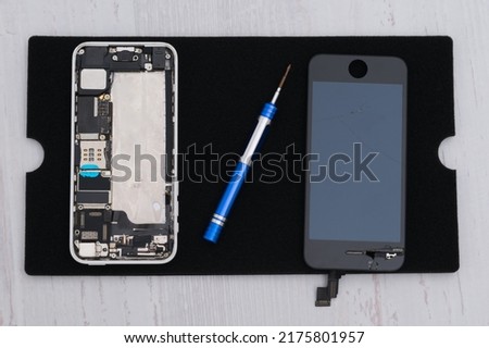 mobile phone with the battery removed, in the process of repair and troubleshooting