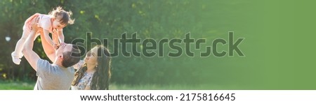 Banner Happy Young Mixed Race Ethnic Family Walking In The Park Royalty-Free Stock Photo #2175816645
