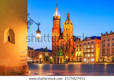 Krakow, Poland. Bazylika Mariacka church and Cloth Hall on Main Square Cracovia, illuminated in the night
