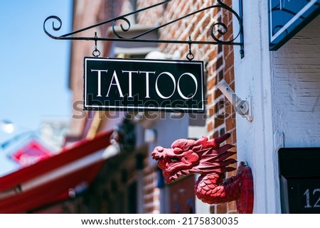 A tattoo sign hanging on a building in downtown Gettysburg, PA.