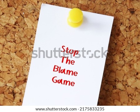 Paper note pin on cork board with text STOP THE BLAME GAME, situation when people attempt to blame each other when bad things has happened Royalty-Free Stock Photo #2175833235