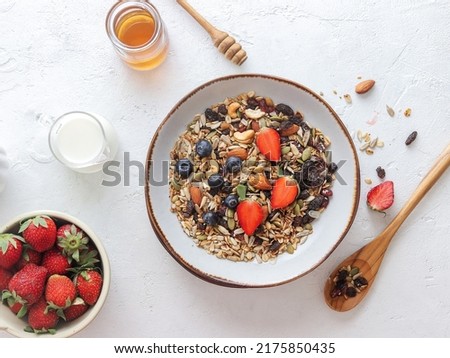 breakfast atmosphere with Granola and some fresh berries, in rustic style and bright mood food photography and angle flatlay