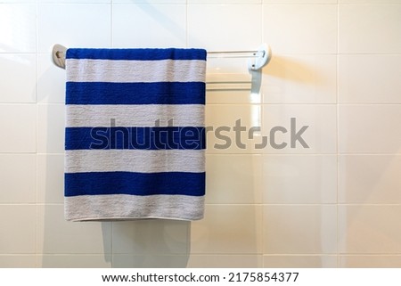 Closeup towel hanging on clothesline in the bathroom with space for texts