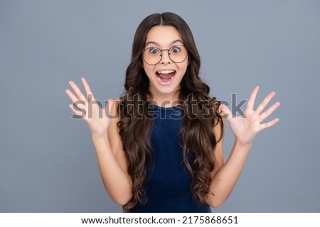 Portrait of emotional positive teenage child girl shouting in amazement or astonishment face, astonished with surprise. Excited face, cheerful emotions of teenager girl.