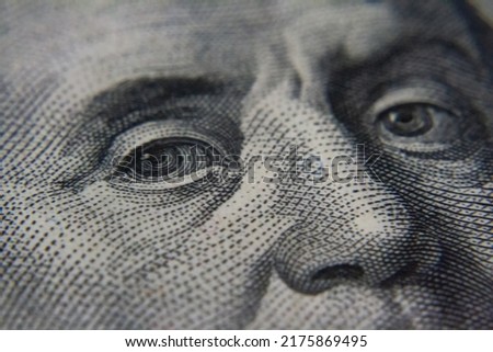 View of Franklin from a hundred dollar bill. Image on the bill. One hundred dollars. U.S. currency. Close-up picture of the money. A look.