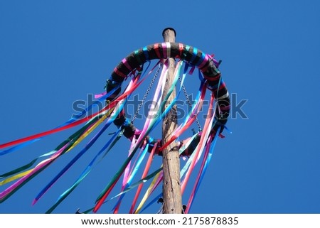 Colorful Festive Ribbons And Beautiful Blue Sky Background. Maypole Set-Up, Customs With A Long Tradition, Germany.  Royalty-Free Stock Photo #2175878835