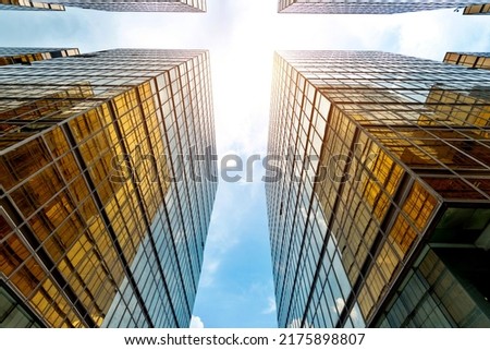 Low angle view of modern office buildings in HongKong. Royalty-Free Stock Photo #2175898807