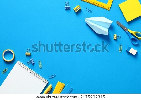 Flat lay school stationery on blue table. Back to school concept. Flat lay, top view 