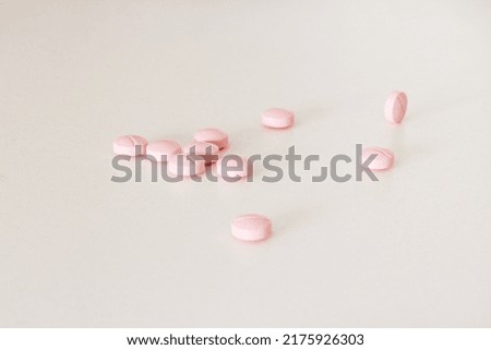 Medicine pills on white surface. Selective focus.