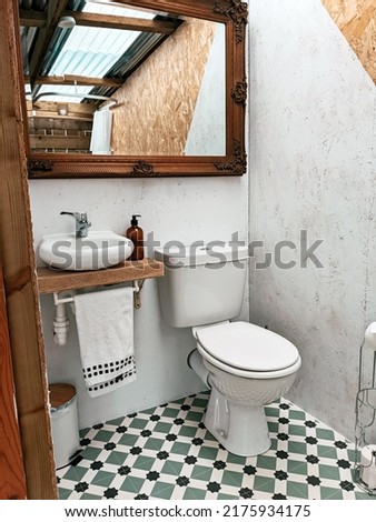 outdoor toilet big mirror Victorian flooring  Royalty-Free Stock Photo #2175934175