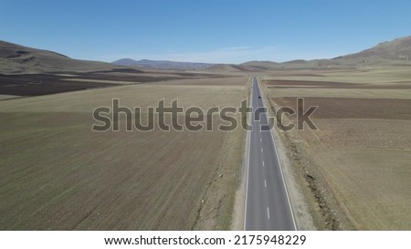 Long Highway Across Rural Fields. Road. Highway. Way. Freeway. Aerial Photo. Landscape. Cars on the Highway. Aerial Photography.