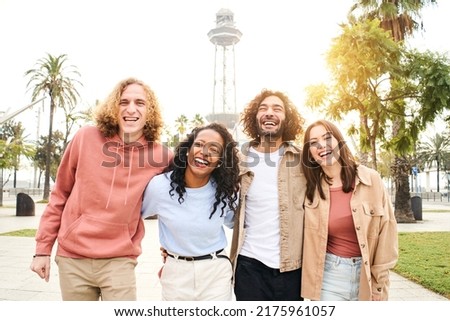 Selfie of Group of young cheerful people looking at the camera outdoors. Happy smiling couples hugging and having fun. Concept of community and youth lifestyle