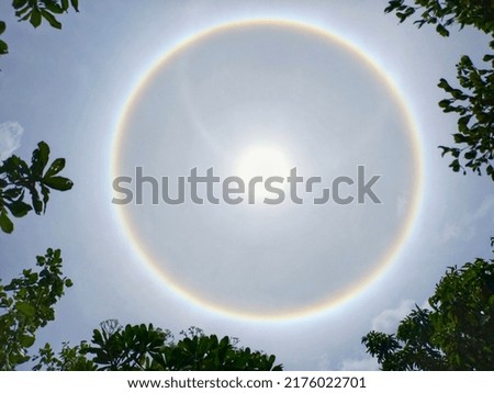 The picture of natural phenomena with light around the sun is very beautiful.