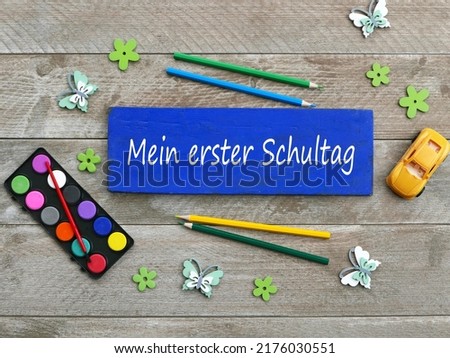 Paint box and colored pencils with the text mein erster Schultag,mein erster Schultag translates as my first day of school.