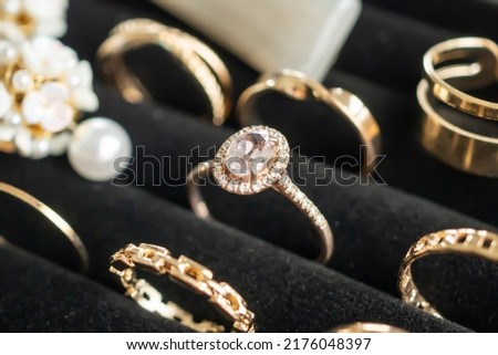 Gold jewelry diamond rings show in luxury retail store display showcase Royalty-Free Stock Photo #2176048397