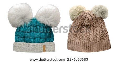 two  knitted turquoise white and beige  hats isolated on white background.hat with pompon front view.