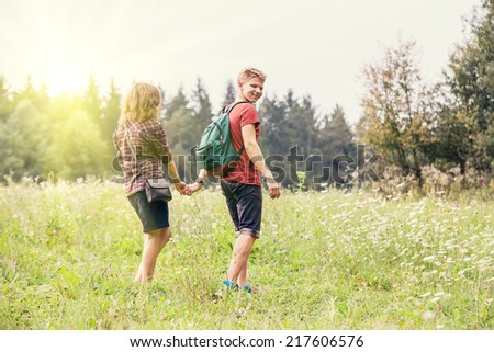 Young couple walks outdoor 
