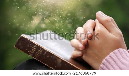 Christian Crisis Prayer to God Man praying to God for a better life human hands praying to god with bible believe in good Hold hands and pray. Royalty-Free Stock Photo #2176068779