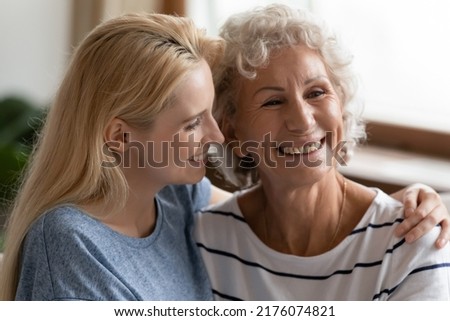I have always looked up to you, granny. Smiling young female grown grandkid gently embracing shoulders of happy glad elderly hoary grandma, millennial daughter shows support and care to senior mother Royalty-Free Stock Photo #2176074821