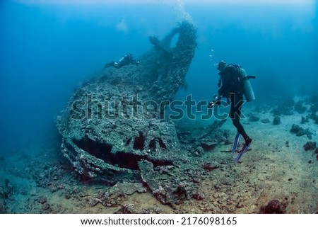 Two divers exploring the ship wreck Dunraven in the red sea Royalty-Free Stock Photo #2176098165