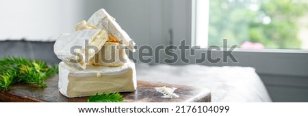 Coulommiers charactere, camembert and brie cheese fresh healthy meal food snack diet on the table copy space food background rustic Royalty-Free Stock Photo #2176104099