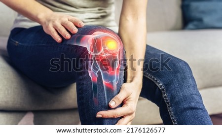 VFX Joint and Knee Pain Augmented Reality Render. Close Up of a Person Experiencing Discomfort in a Result of Leg Trauma or Arthritis. Massaging the Muscles to Ease the Injury. Royalty-Free Stock Photo #2176126577