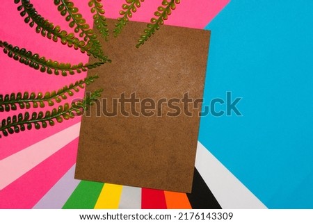 colorful background with vintage wooden cardboard as copy space, creative modern art design, around jungle leaves, trendy retro style